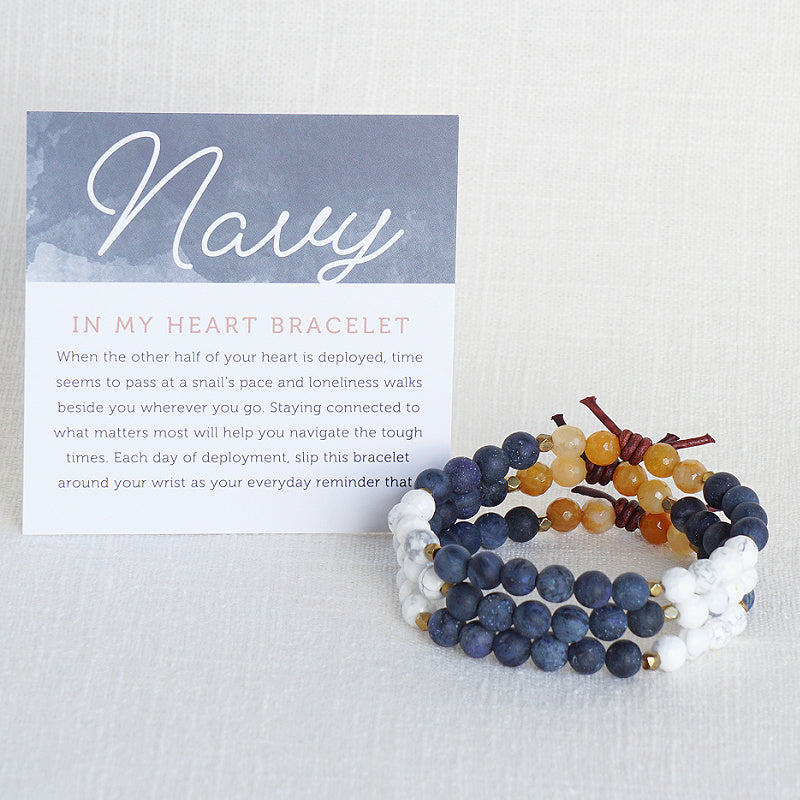 In My Heart Navy Bracelet with Meaning Card - When the other half of your heart is deployed, time seems to pass at a snail’s pace and loneliness walks beside you wherever you go. Staying connected to what matters most will help you navigate the tough times. Each day of deployment, slip this bracelet around your wrist as your everyday reminder that your hero is always in your heart even though there are miles between you.