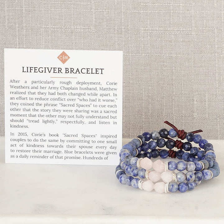Lifegiver Bracelet with Meaning Card - The Lifegiver bracelet keeps with the same blue color theme, but adds two Rose Quartz stones that symbolize two unfinished souls that are challenged to forgive, open their hearts, heal emotional wounds and establish peace. Wear it as an everyday reminder that you have more influence than you think to change the course of your marriage.