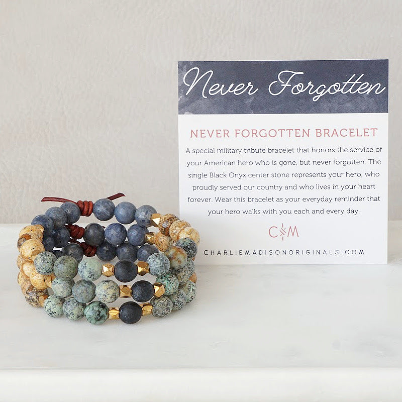 Never Forgotten Bracelet with Meaning Card - A special military tribute bracelet that honors the service of your American hero who is gone, but never forgotten. The single Black Onyx center stone represents your hero, who proudly served our country and who lives in your heart forever. Wear the Never Forgotten Bracelet as your everyday reminder that your hero walks with you each and every day.