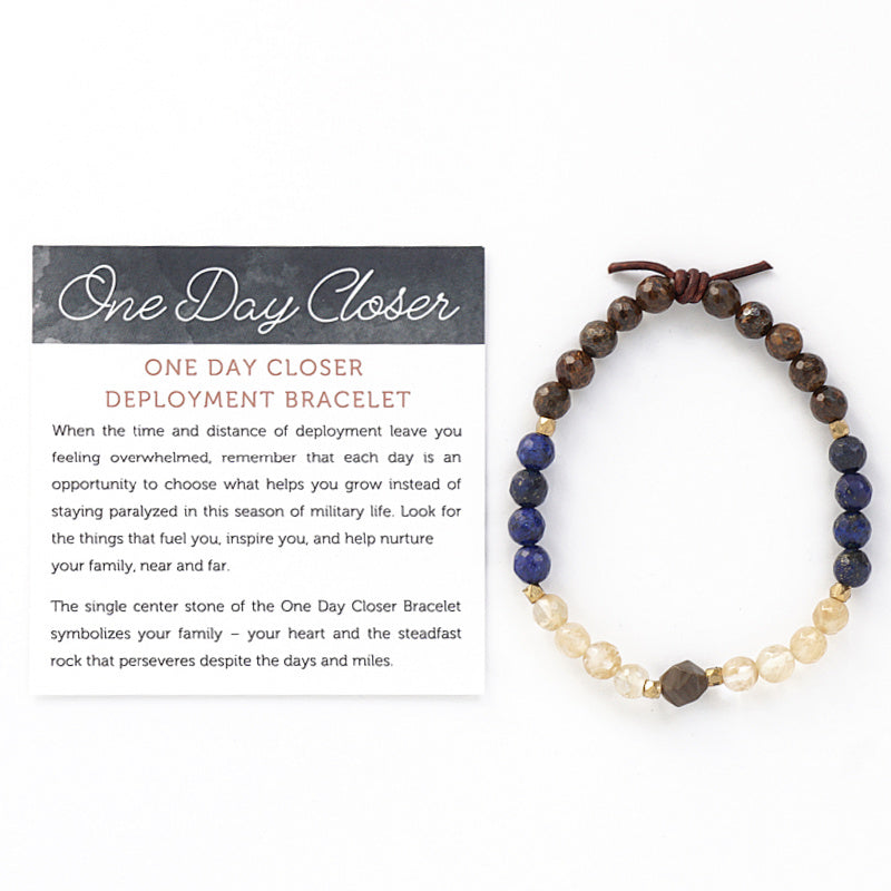 One Day Closer Mini Bracelet with Meaning Card - The single center stone of the One Day Closer Bracelet symbolizes your family – your heart and the steadfast rock that perseveres despite the days and miles. Each day of deployment slip the bracelet on your wrist and make a conscious choice to focus on one thing that helps you feel connected and supported until your family is reunited. Wear the One Day Closer Bracelet as your everyday reminder to not just count the days, but to make every day count.