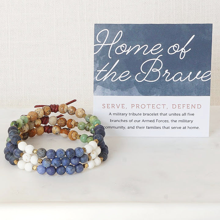Home of The Brave Mini Bracelet Stack with Meaning Card - Our military heroes and their families are united in service and mission - from the fallen to veterans to active duty. Wear the Home of the Brave Bracelet with pride, like your everyday armor, to remind you that you’re connected to your American hero, supported by your military community, and that you’re not alone on this journey.
