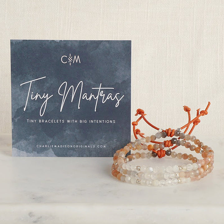 Tiny Mantras Bracelet – Peach Moonstone with Meaning Card - A tiny bracelet with big intentions! Made with faceted multi-colored Peach Moonstone gemstones, this dainty everyday stacking bracelet will help you keep your favorite mantra top of mind as you move through your day.