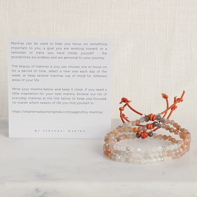 Tiny Mantras Bracelet – Peach Moonstone with Meaning Card - A tiny bracelet with big intentions! Made with faceted multi-colored Peach Moonstone gemstones, this dainty everyday stacking bracelet will help you keep your favorite mantra top of mind as you move through your day.