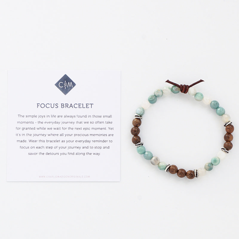 Focus Bracelet with Meaning Card - The simple joys in life are always found in those small moments - the everyday journey that we so often take for granted while we wait for the next epic moment. Yet it’s in the journey where all your precious memories are made. Wear this bracelet as your everyday reminder to focus on each step of your journey and to stop and savor the detours you find along the way.