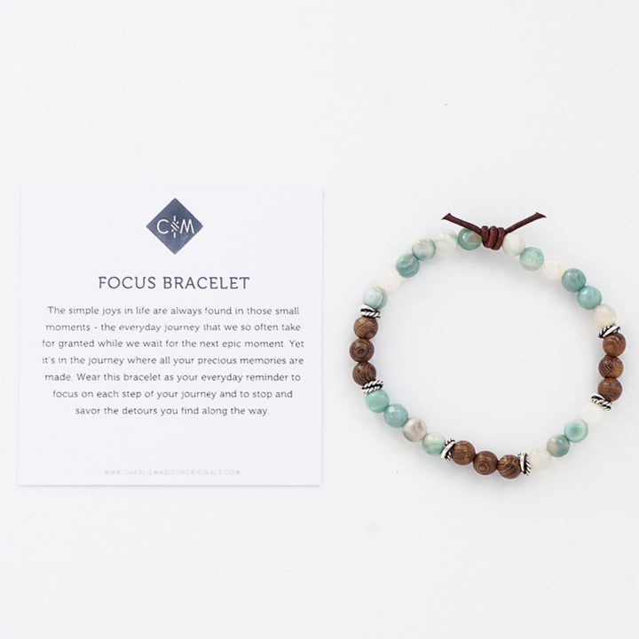 Focus Bracelet with Meaning Card - The simple joys in life are always found in those small moments - the everyday journey that we so often take for granted while we wait for the next epic moment. Yet it’s in the journey where all your precious memories are made. Wear this bracelet as your everyday reminder to focus on each step of your journey and to stop and savor the detours you find along the way.