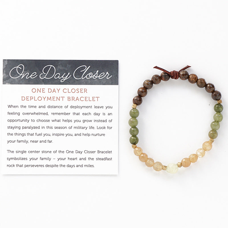 One Day Closer Mini Bracelet with Meaning Card - The single center stone of the One Day Closer Bracelet symbolizes your family – your heart and the steadfast rock that perseveres despite the days and miles. Each day of deployment slip the bracelet on your wrist and make a conscious choice to focus on one thing that helps you feel connected and supported until your family is reunited. Wear the One Day Closer Bracelet as your everyday reminder to not just count the days, but to make every day count.